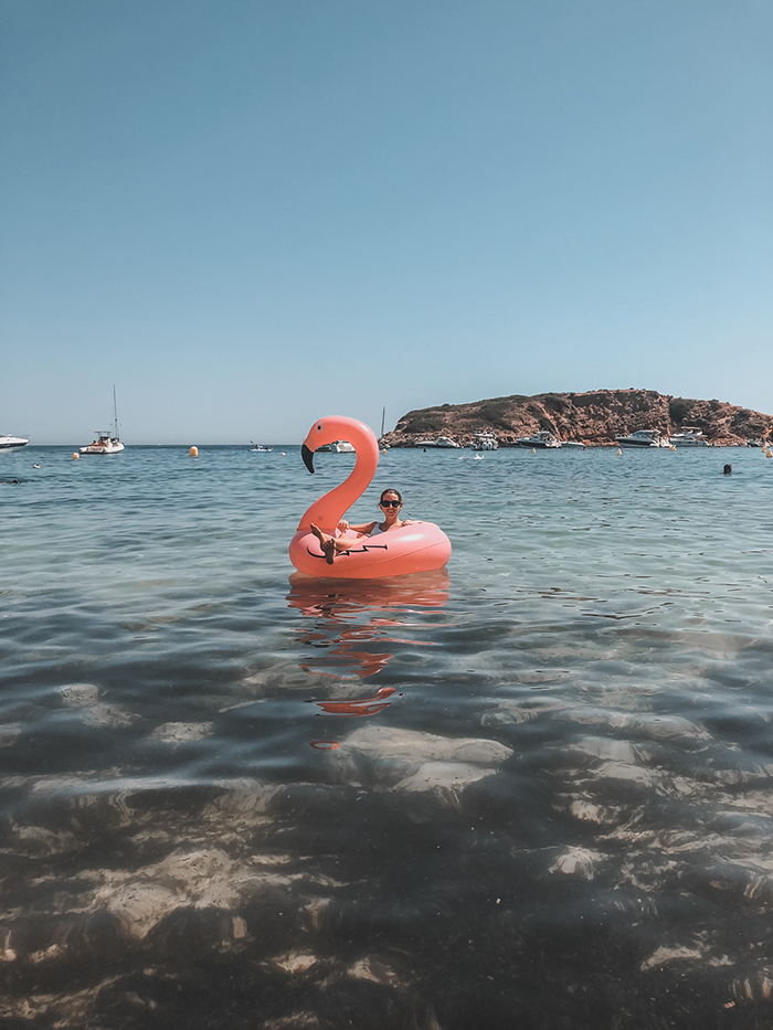Portals Nous Beach Mallorca Girl on Flamingo float 
